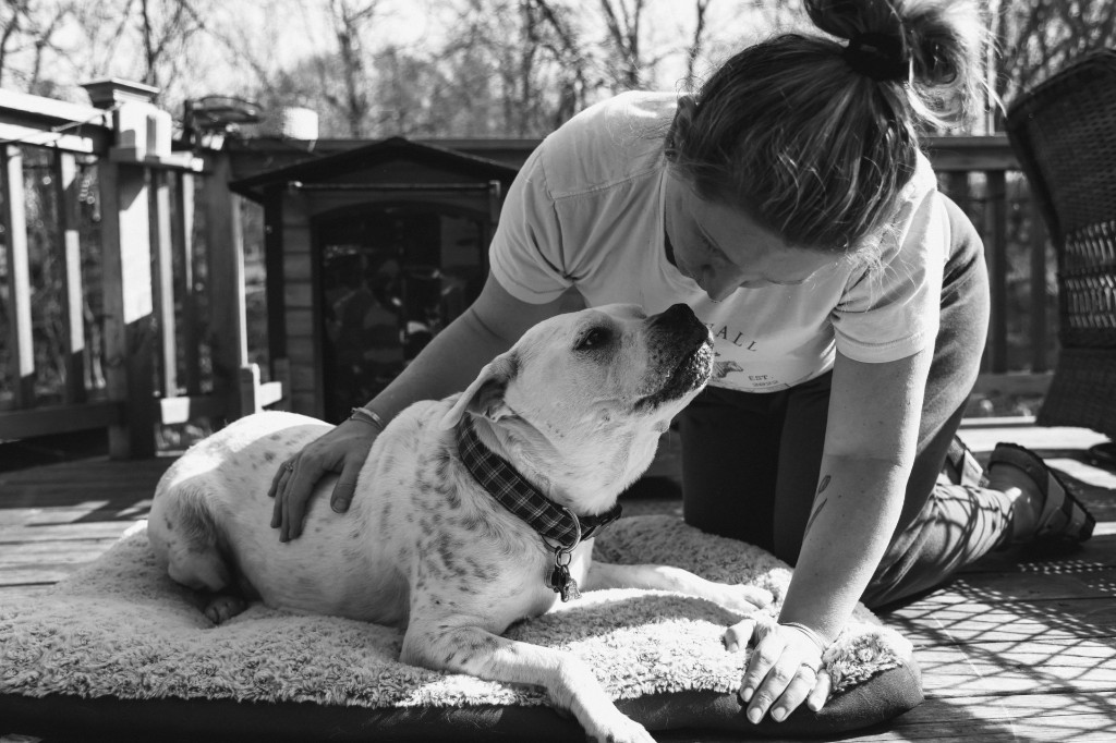 Bo resting on the deck, nose to nose with Christine